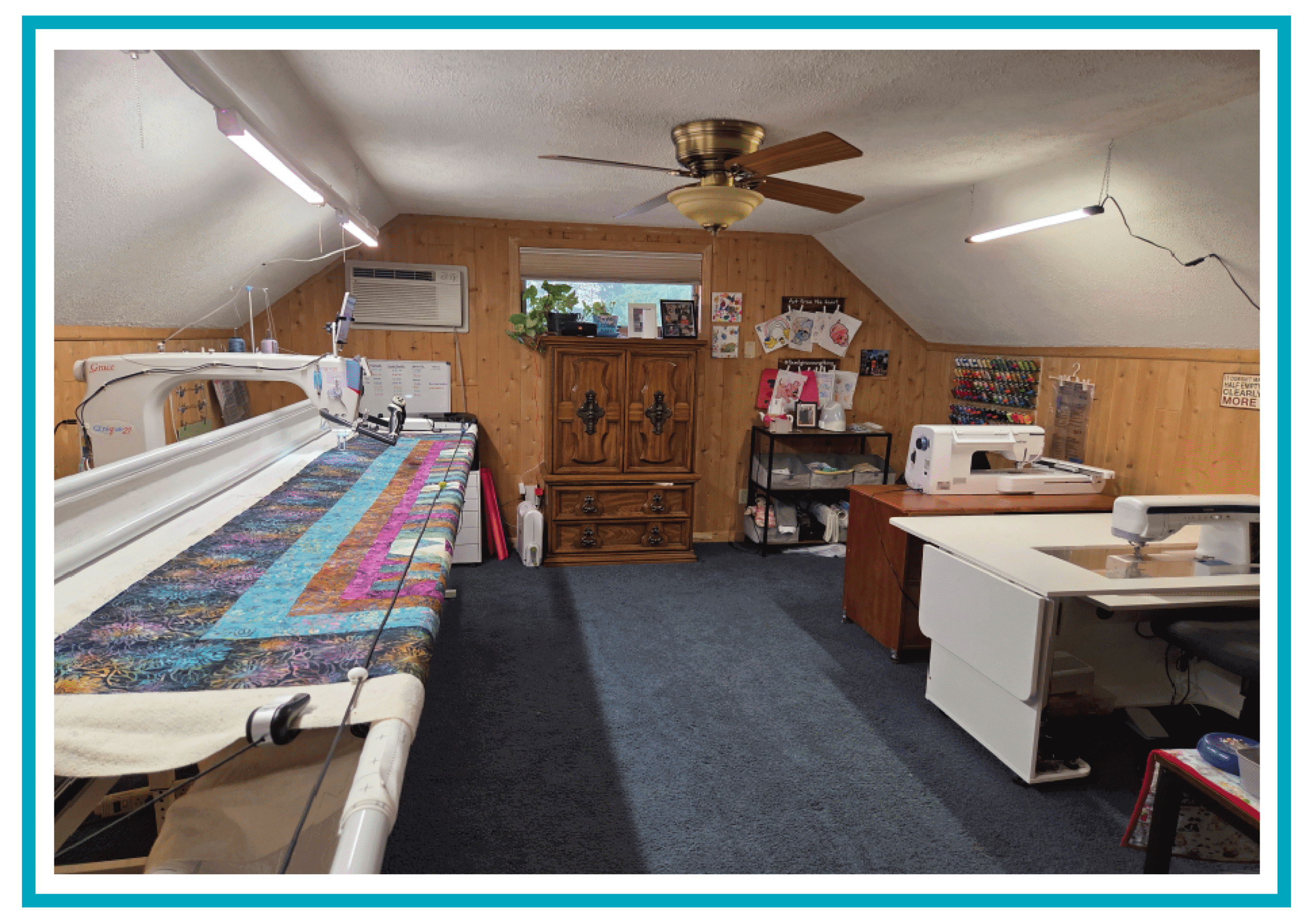 Quilting room with sewing machines and fabric.