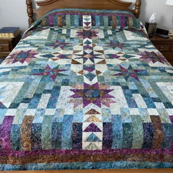 Quilted bedspread with colorful geometric patterns.